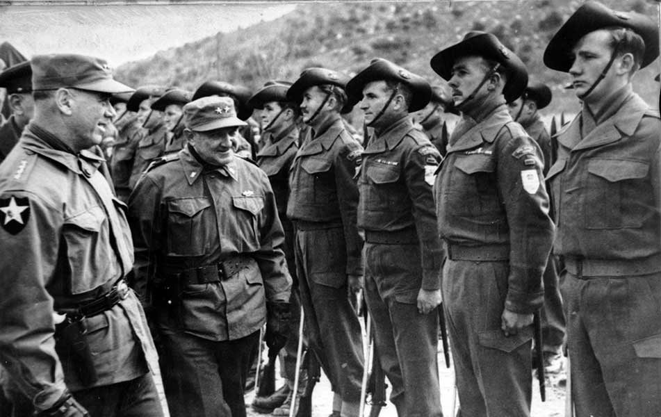 Australians in Korean War: General Van Fleet, General Officer Commanding, 8th US Army (far left) inspects members of the 3rd Battalion (3RAR)